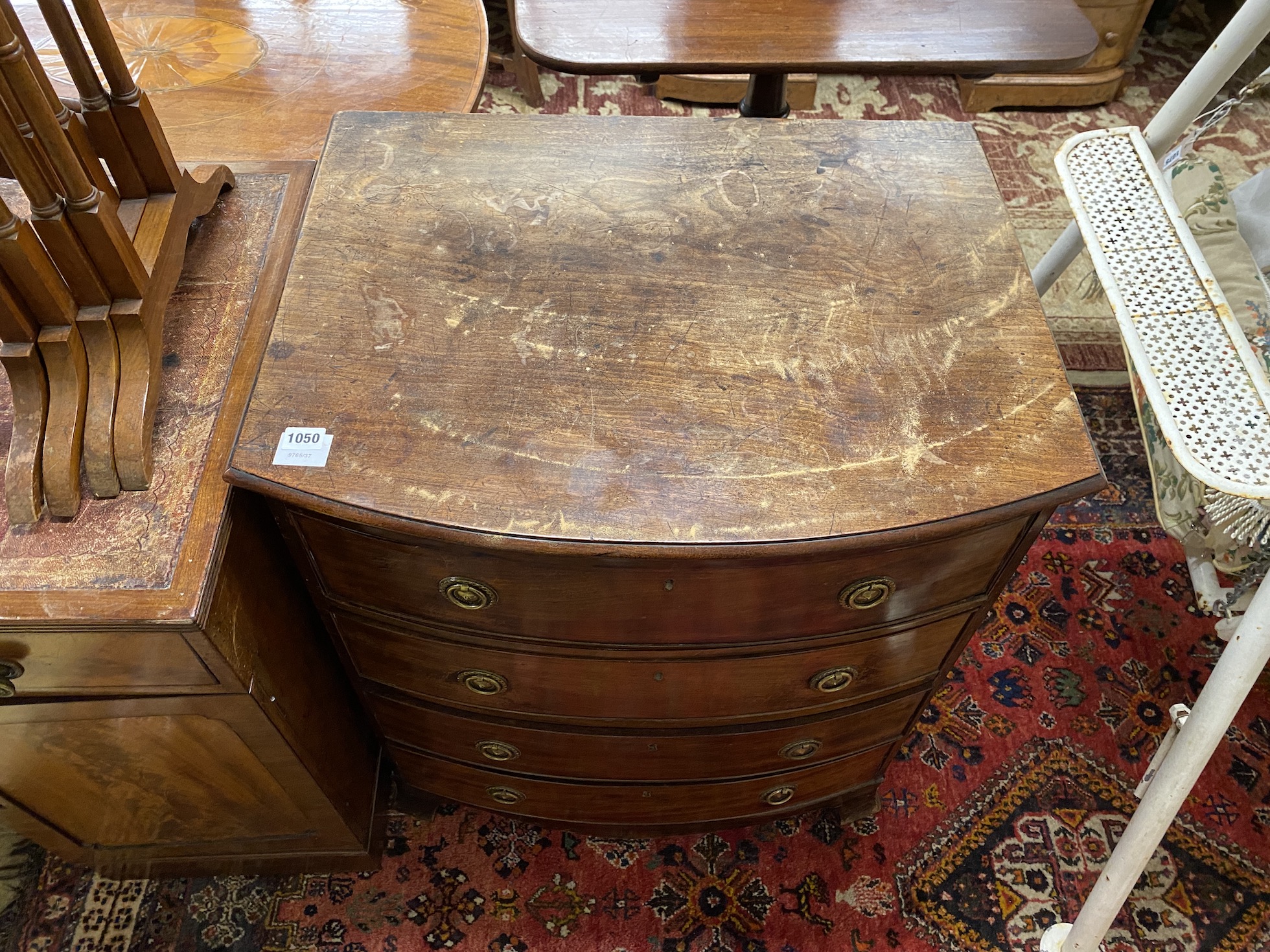 A small Regency style mahogany bow front chest of drawers, width 70cm, depth 54cm, height 79cm